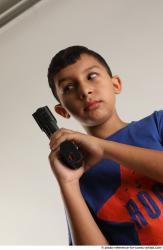 TIMBO STANDING POSE WITH GUN